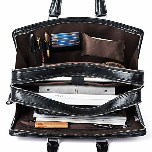 Interior of an open leather briefcase with books and pens.